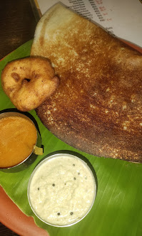 Dosa served with vada, chutney and sambar